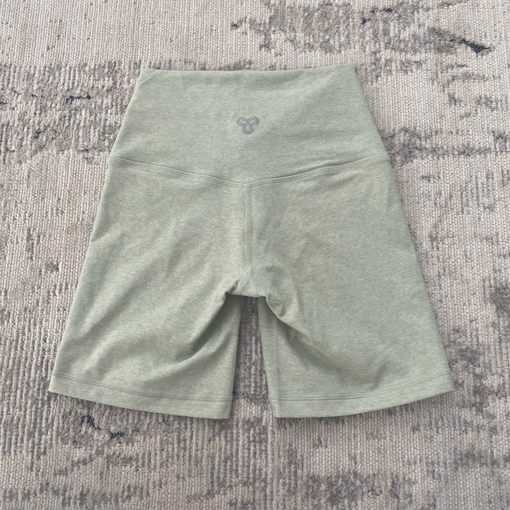 Sage green TnAction shorts from Aritzia